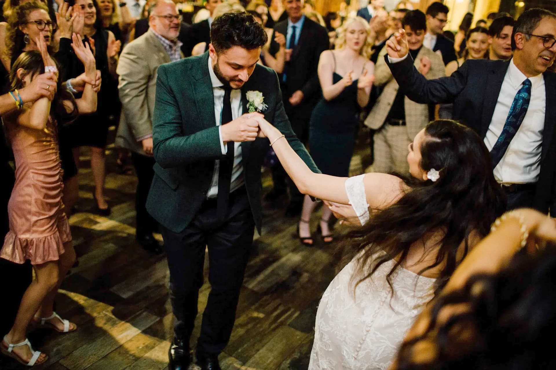 Guests celebrating on a packed dance floor at a formal Nicholson Events reception