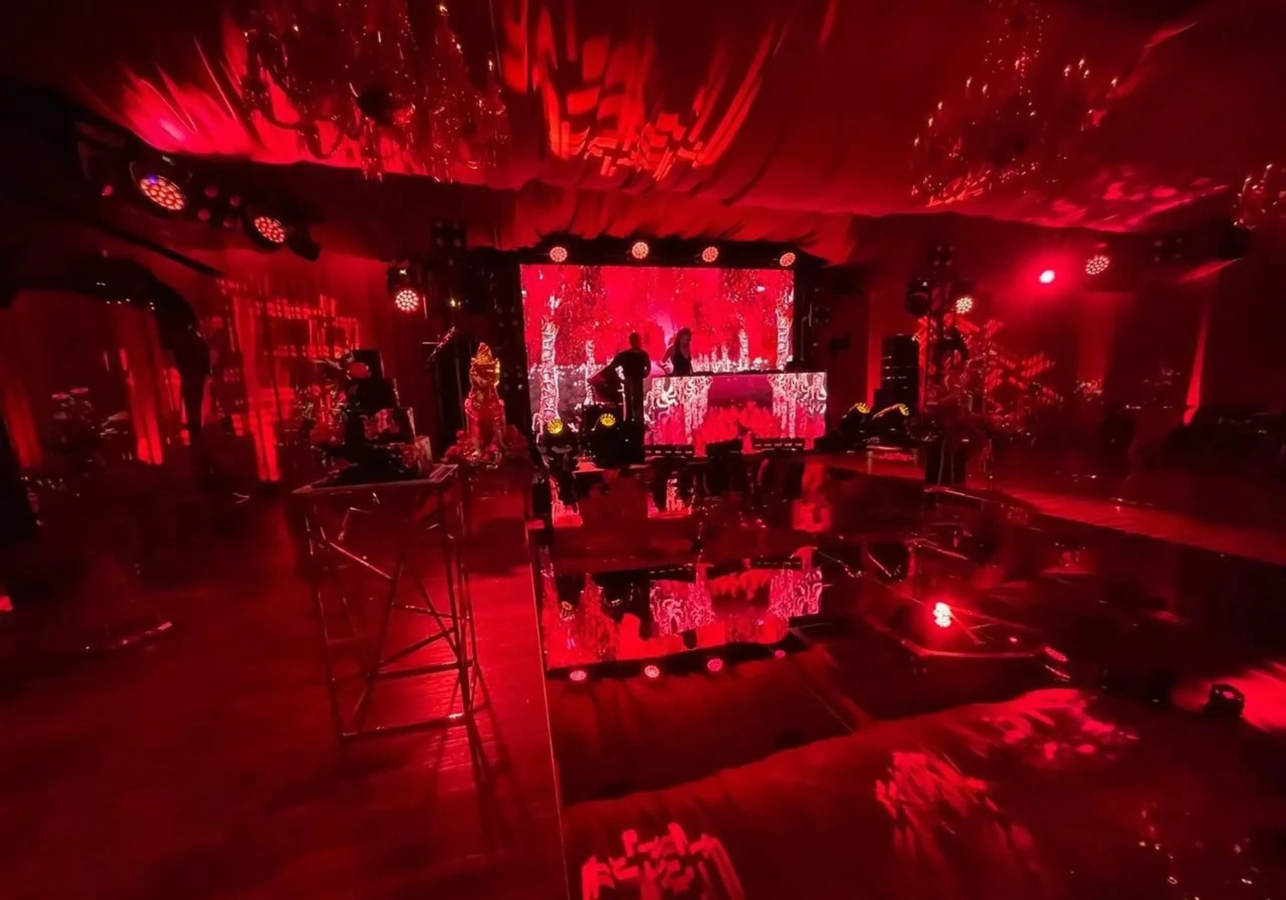 Nicholson Events LED stage production with red lighting at a luxury event